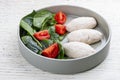 Steamed cutlets of three kinds of white meat with fresh spinach and tomatoes