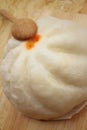 Steamed dumpling - chinese bun on brown background. Royalty Free Stock Photo