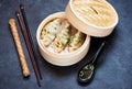 Steamed dumplings in bamboo steamer with chopsticks and soy sauce Royalty Free Stock Photo