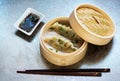 Steamed dumplings Gyoza in bamboo steamer with soy sauce Royalty Free Stock Photo