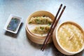 Steamed dumplings Gyoza in bamboo steamer with soy sauce Royalty Free Stock Photo