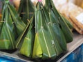 Steamed Flour with Coconut Filling Thai desserts and snacks Canape, sweet coconut and powder food wrapped in banana leaves