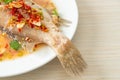 Steamed grouper fish with lime and chillies Royalty Free Stock Photo