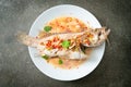 Steamed grouper fish with lime and chillies Royalty Free Stock Photo