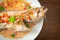 Steamed grouper fish with lime and chillies Royalty Free Stock Photo