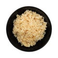 steamed healthy unpolished brown rice in black bowl isolated on