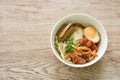 steamed large rice noodles topping slice fried Chinese sausage and pork belly with bean sprout dressing black soy sauce on bowl