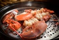 Steamed lobster with big claws on pan Royalty Free Stock Photo