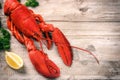 Steamed lobster with lemon on wooden background Royalty Free Stock Photo
