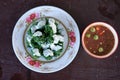 Steamed local vegetable with coconut milk on the top serve with seafood chili paste