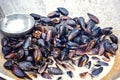 Steamed mussels in white wine sauce cooking at large metallic pan. Fresh mussels at grill pan. Seafood barbecue outdoors. Picnic h Royalty Free Stock Photo