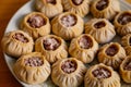 Steamed national Mongolian food dumpling Buuz filled with minced beef, white plate, wooden table, Close up east Siberian Buryats