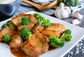 Steamed pork with balsamic vinegar and roasted broccoli and rice Royalty Free Stock Photo