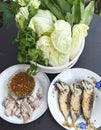 Steamed pork with dipping sauce and fried mackerel with vegetables Royalty Free Stock Photo