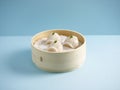 Steamed Prawn Dumpling Ha Kau served in a wooden bowl isolated on mat side view on grey background