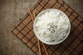 Steamed rice and black sesame seeds with chopsticks on a bamboo mat Royalty Free Stock Photo