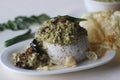 Steamed rice cake served with green gram curry and papad. A favorite dish of Kerala commonly known as puttu with payar and
