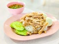 Steamed rice topped with chicken on the dish. Thai delicious food