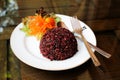 Steamed riceberry rice on a plate