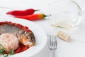 Steamed sea bass in tomato sauce with chili pepper. Royalty Free Stock Photo