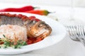 Steamed sea bass in tomato sauce with chili pepper. Royalty Free Stock Photo