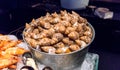 Steamed sea snails in ice bucket by prawns and mussels on ice