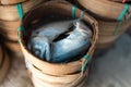 Steamed short body mackerel fish, Pla-Tu, in a flat-round bamboo basket