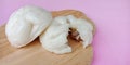 Steamed stuff bun on pink background. Royalty Free Stock Photo