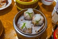 Steamed stuffed shrimp dumpling in Chinese dimsum bamboo steamer box