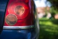 Steamed tail light on Toyota Avensis car in soft focus