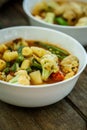 Steamed vegetables in a bowl on wooden table Royalty Free Stock Photo