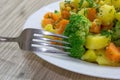 Steamed Vegetables Potatoes, Carrots, Broccoli,Corn with Fresh Herbs. Healthy and dietetic food