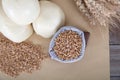 Steamed white noodle buns and raw wheat and wheat ears Royalty Free Stock Photo