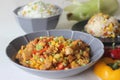 Steamed white rice served with sorted chicken, sweet corn, baby corn, spring onions and bell peppers