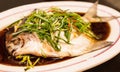 Steamed White Silver Pomfret with spring onion, chili and soy sauce