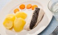 Steamed whiting with potatoes and carrot