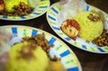 Traditional breakfast dish called `Nasi KUning` or yellow rice Royalty Free Stock Photo