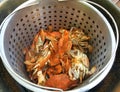 Steamer filled with cooked blue crabs sprinkled with salt and old bay seasoning Royalty Free Stock Photo