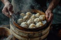 Steaming basket of Xiaolongbao, Chinese soup dumplings, in a traditional bamboo steamer