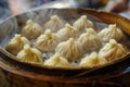 Steaming basket of Xiaolongbao, Chinese soup dumplings, in a traditional bamboo steamer