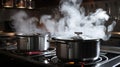 Steaming and boiling pan of water on modern heating stove in kitchen on the background of open balcony. Boiling with steam emitted Royalty Free Stock Photo