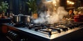 Steaming and boiling pan of water on modern heating stove in kitchen, Water Boiling on a Gas Stove, Stainless pot Royalty Free Stock Photo