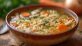 A steaming bowl of chicken noodle soup, brimming with tender chicken, veggies, and comforting broth. Royalty Free Stock Photo