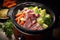 a steaming bowl of corned beef and vegetables cooked in a slow cooker Royalty Free Stock Photo