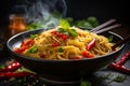 Steaming bowl of noodles with fresh vegetables