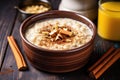 a steaming bowl of oatmeal with sliced banana atop