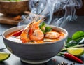 A steaming bowl of Tom Yum Goong, brimming with plump shrimp, aromatic lemongrass, and fiery chili peppers