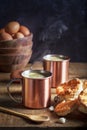 Steaming Coffee in Copper Cups with Biscuits Royalty Free Stock Photo