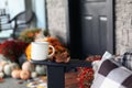 Steaming Coffee Cup on Front Porch Decorated for Autumn Royalty Free Stock Photo