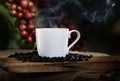 Steaming Coffee with red Coffee beans in background